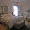 bedroom with queen size bed and access to deck
