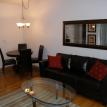 Leather sleeper sofa , dining area, hardwood floors